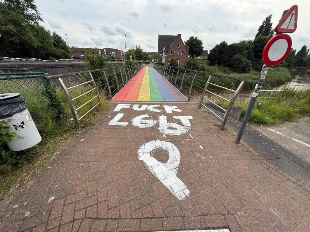 Photograph of homophobic graffiti on Diest's Rainbow Bridge, Belgium, referenced in Kaye Outhwaite's artwork