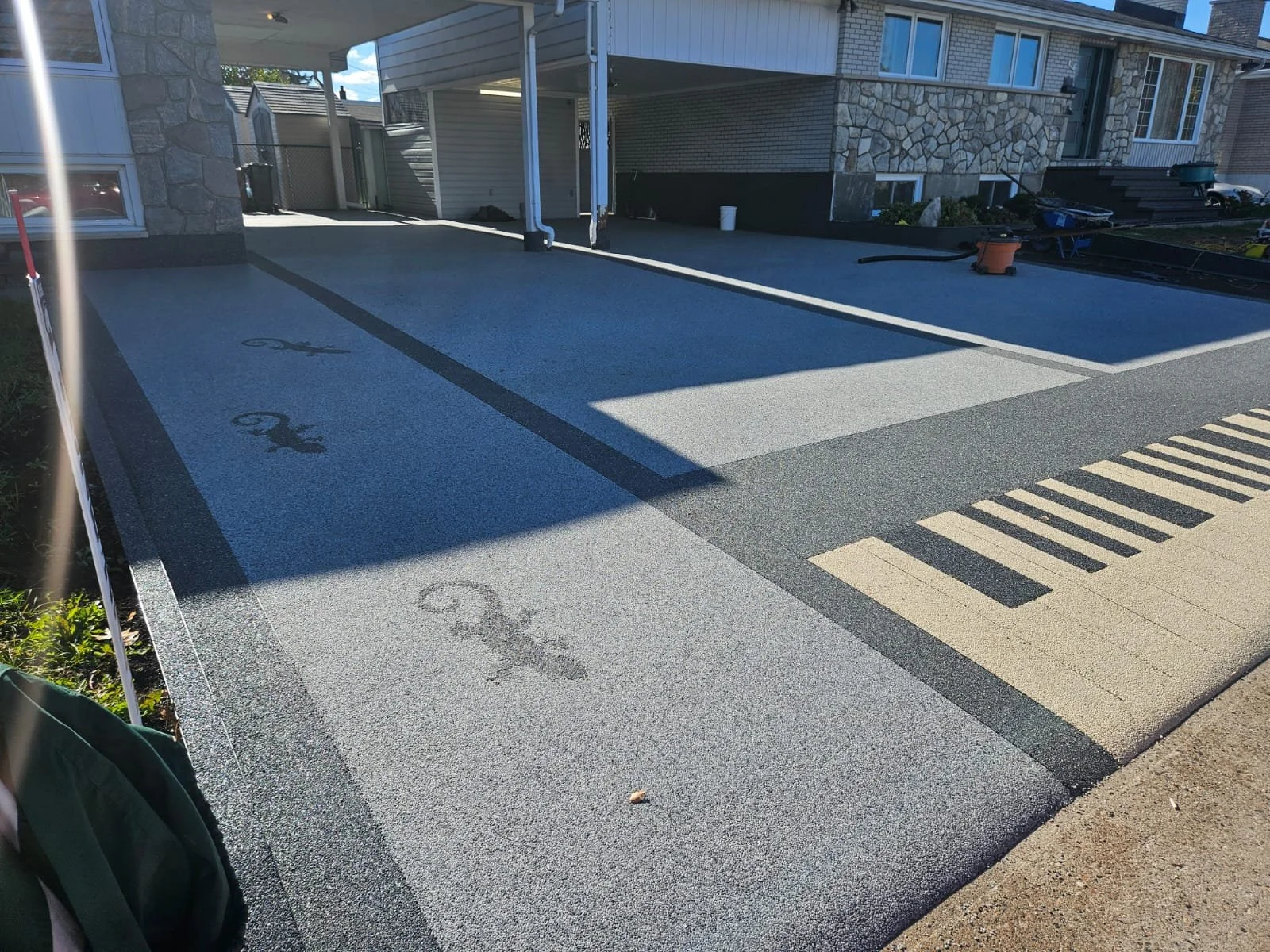 Completed driveway resurfacing with durable stone surface