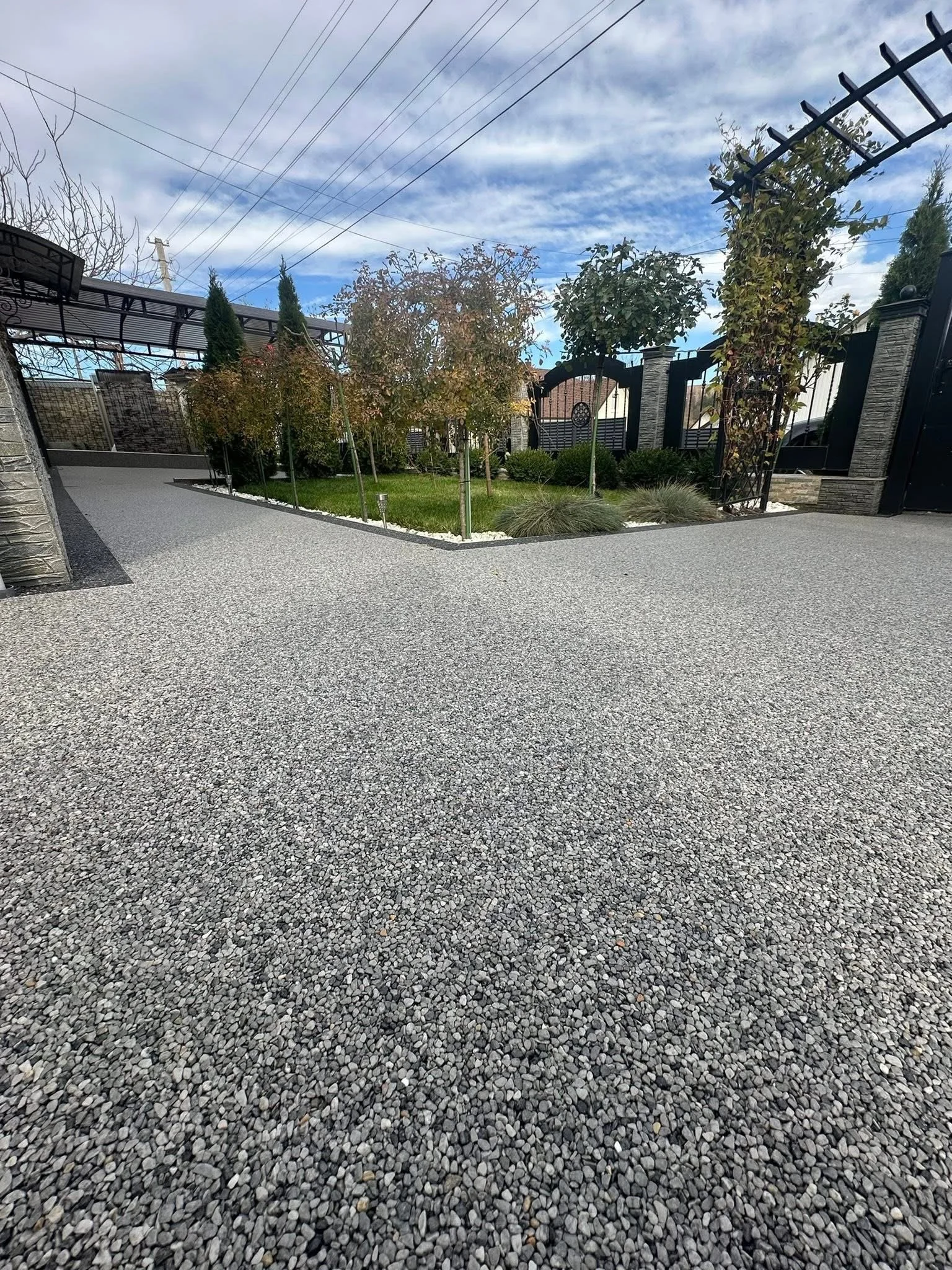 Completed backyard stone patio installation with seamless finish