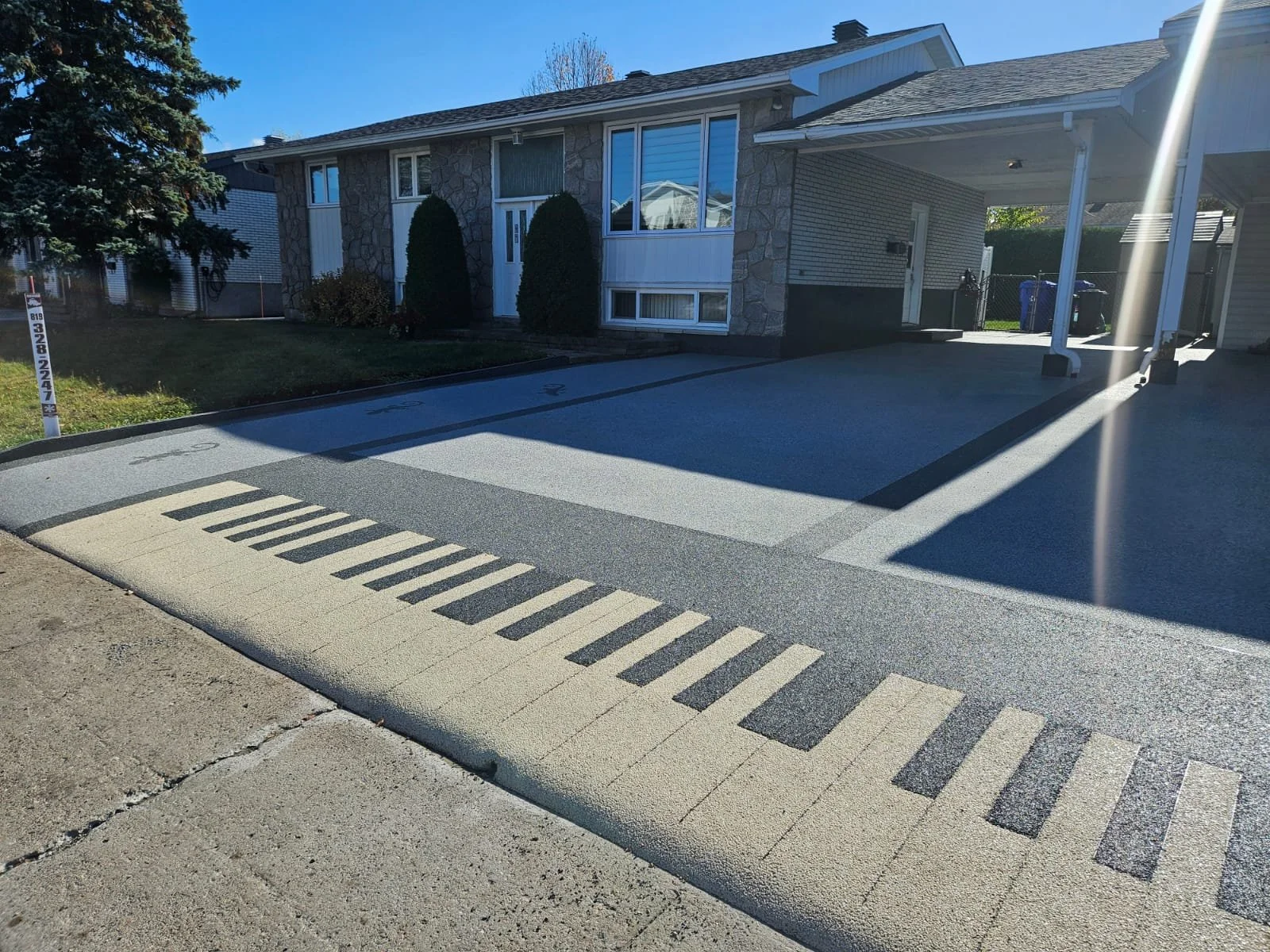 Finished stone driveway installation at residential home