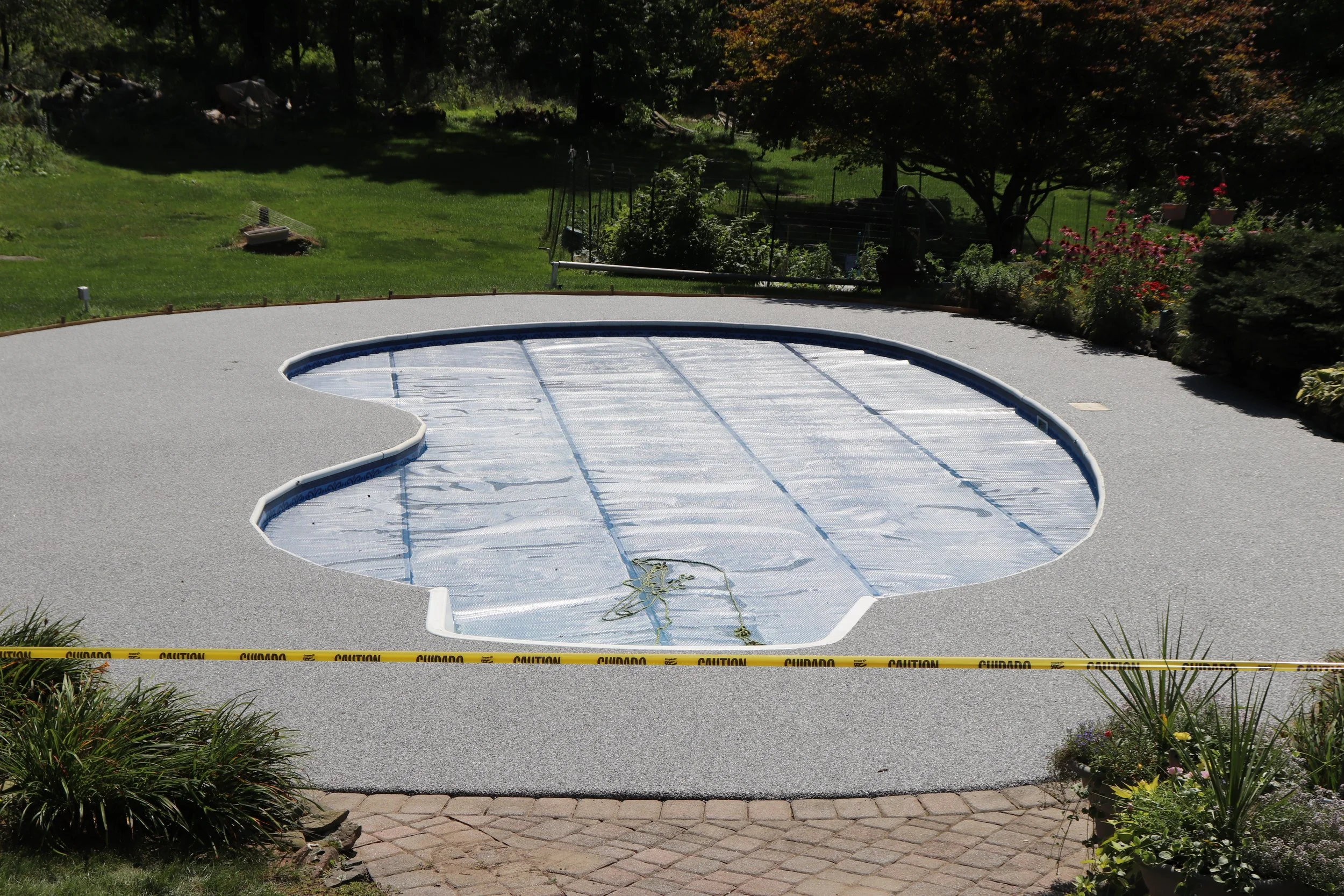 Seamless stone pool deck installation at residential property