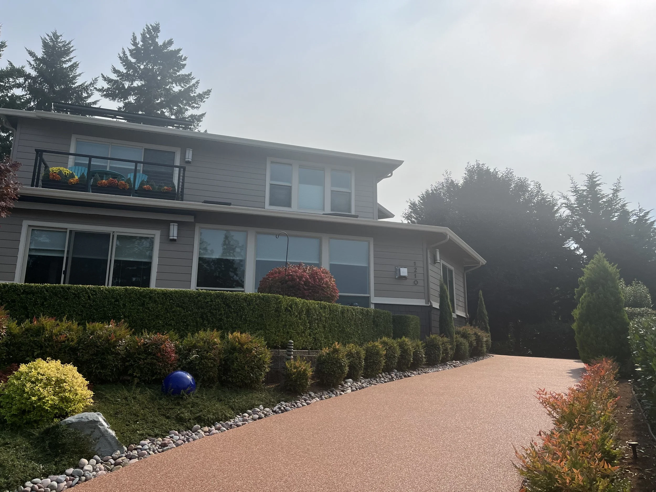 Finished stone driveway installation with seamless surface
