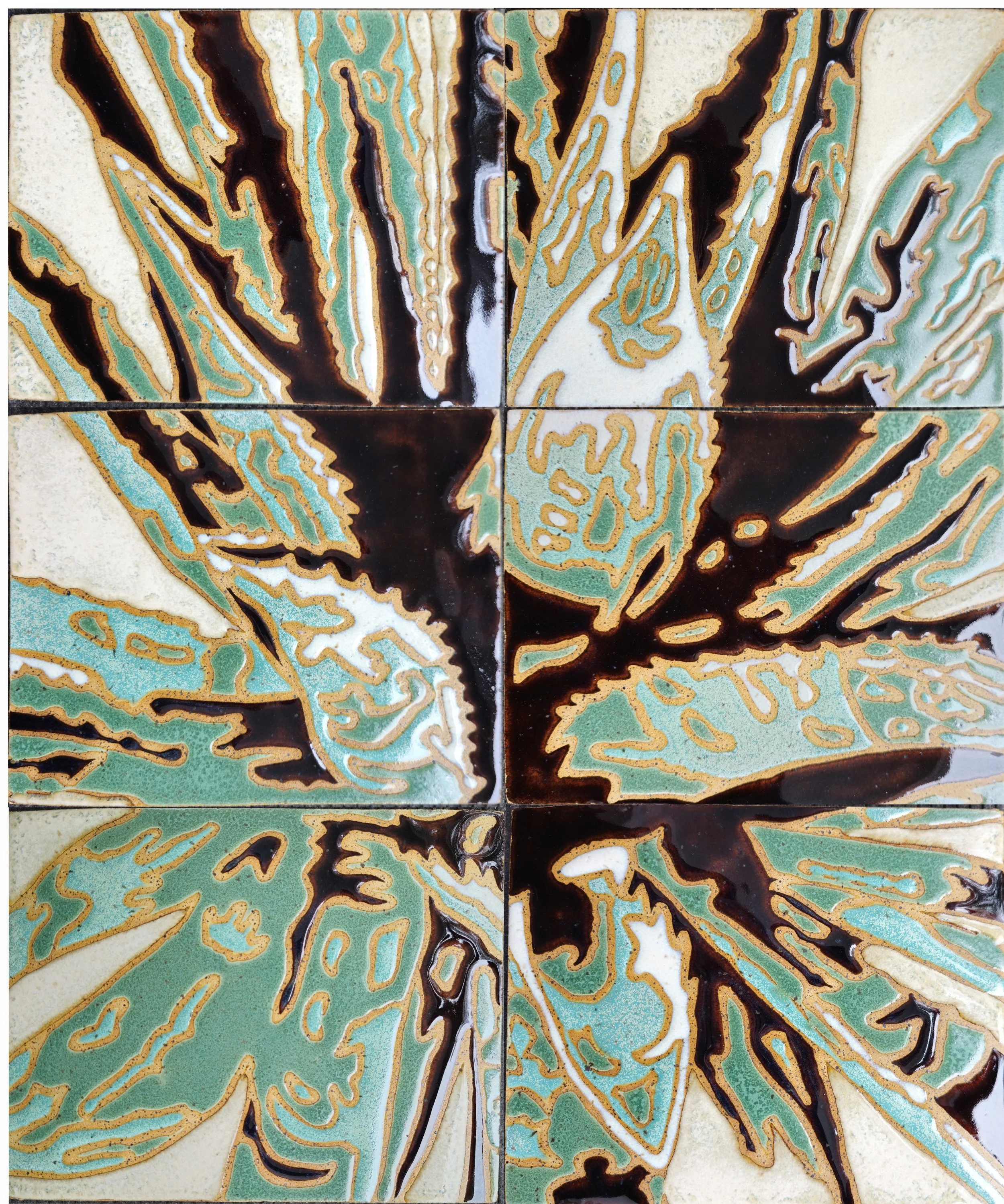 Decorative ceramic tiles with an abstract design in green, cream, white, and black colors.