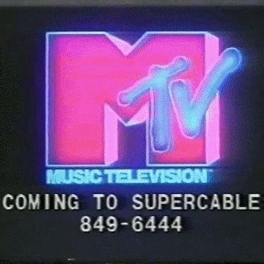 Neon MTV logo with text advertising upcoming supercable channel and phone number.