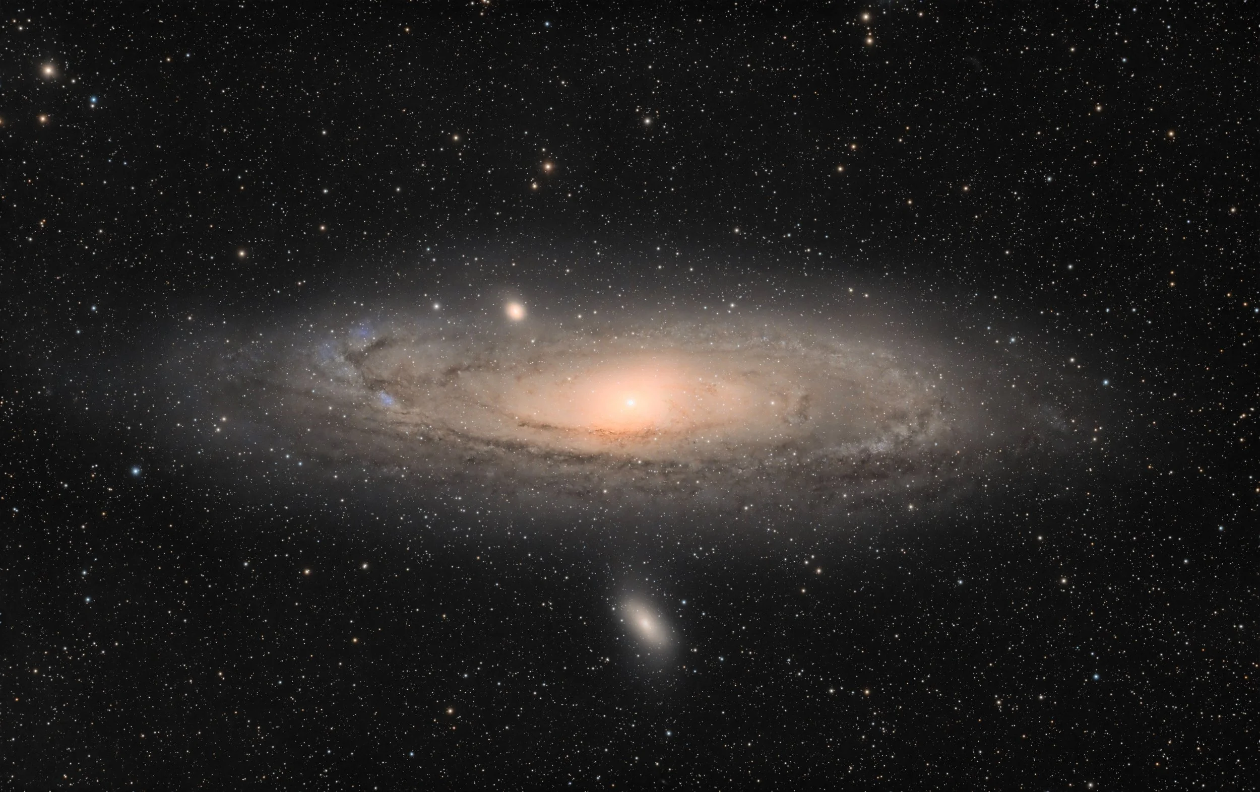 A galaxy in deep space, with stars, dust, and a central bright core surrounded by a glowing, spiral-shaped structure.