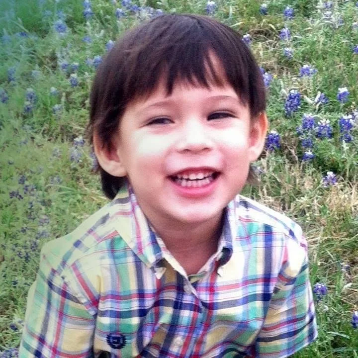 Malachi smiling outdoors