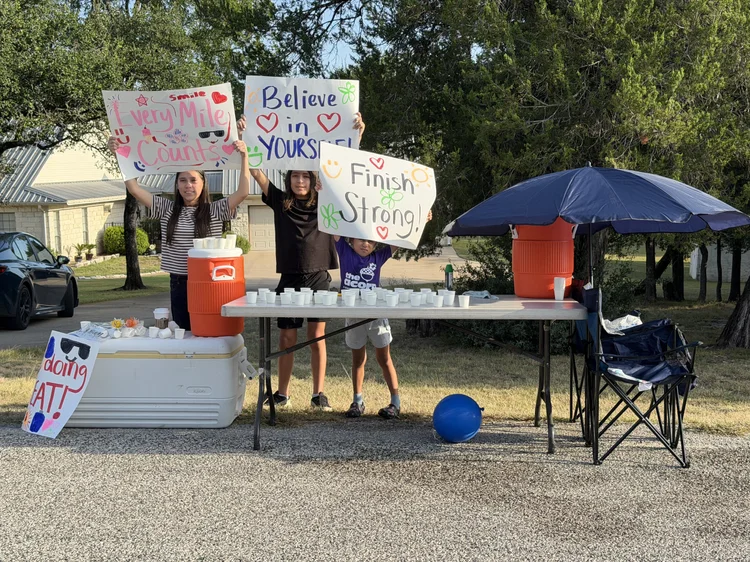 Volunteers holding signs at a community event