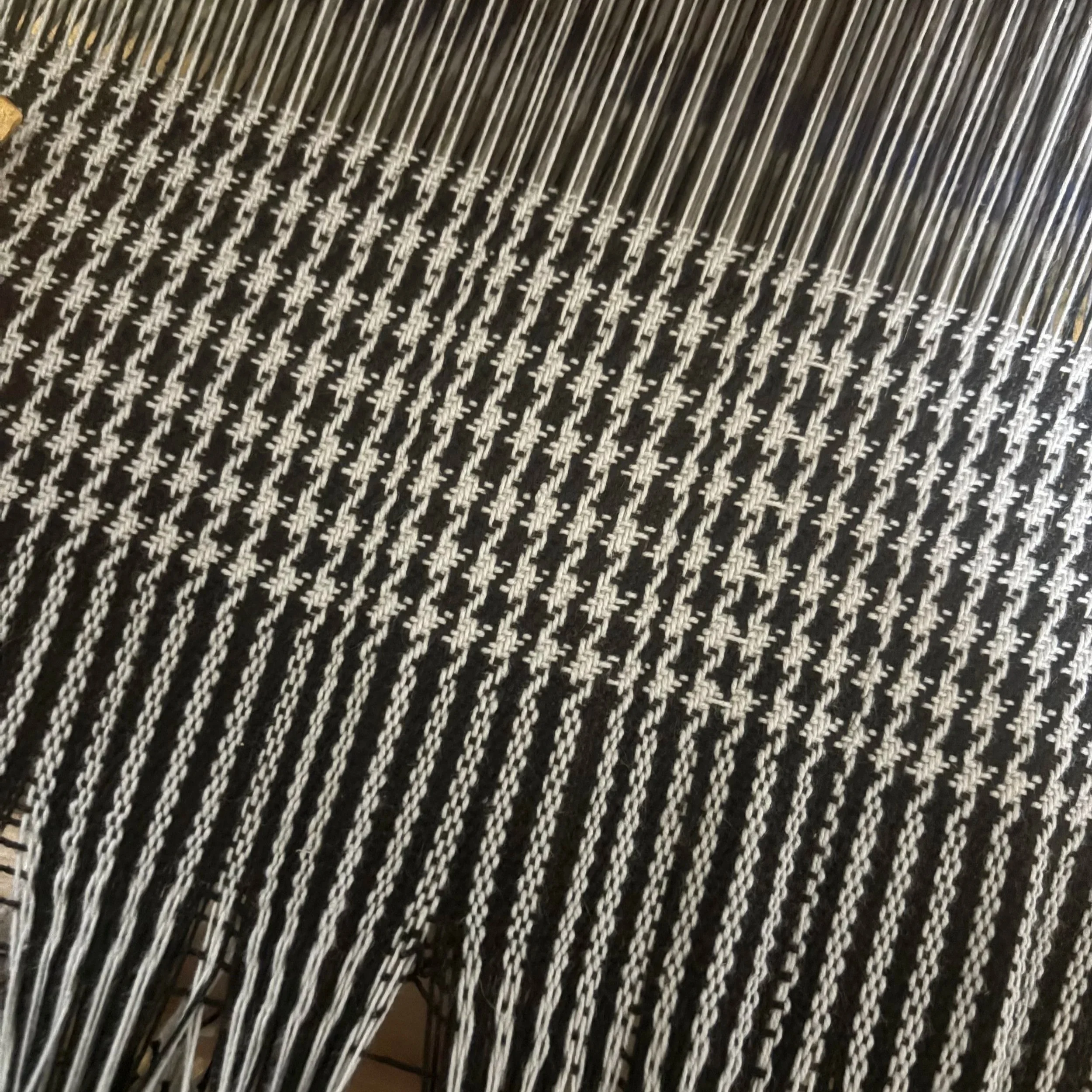 My first time warping my table loom and experimenting with houndstooth.