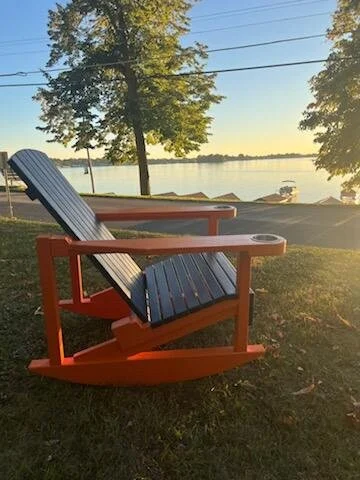Enjoy lake views from a real wooden team rocking chair from Up North Rockers.  Made with Bald Cypress, which is known for its outdoor durability.