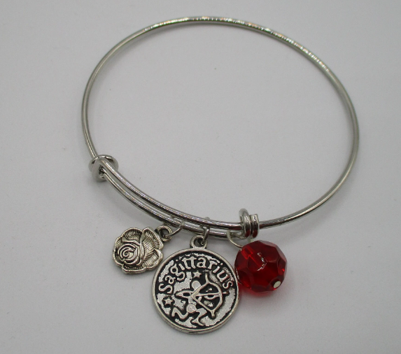 Sagittarius the Optimistic in Red Bangle 2.png