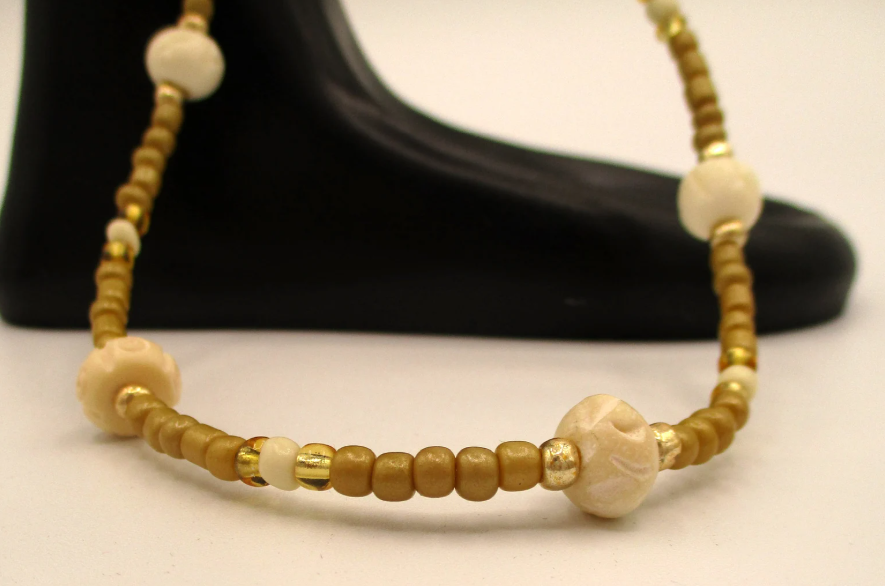 Ithambo Legolide Gold Bone WB 1.png