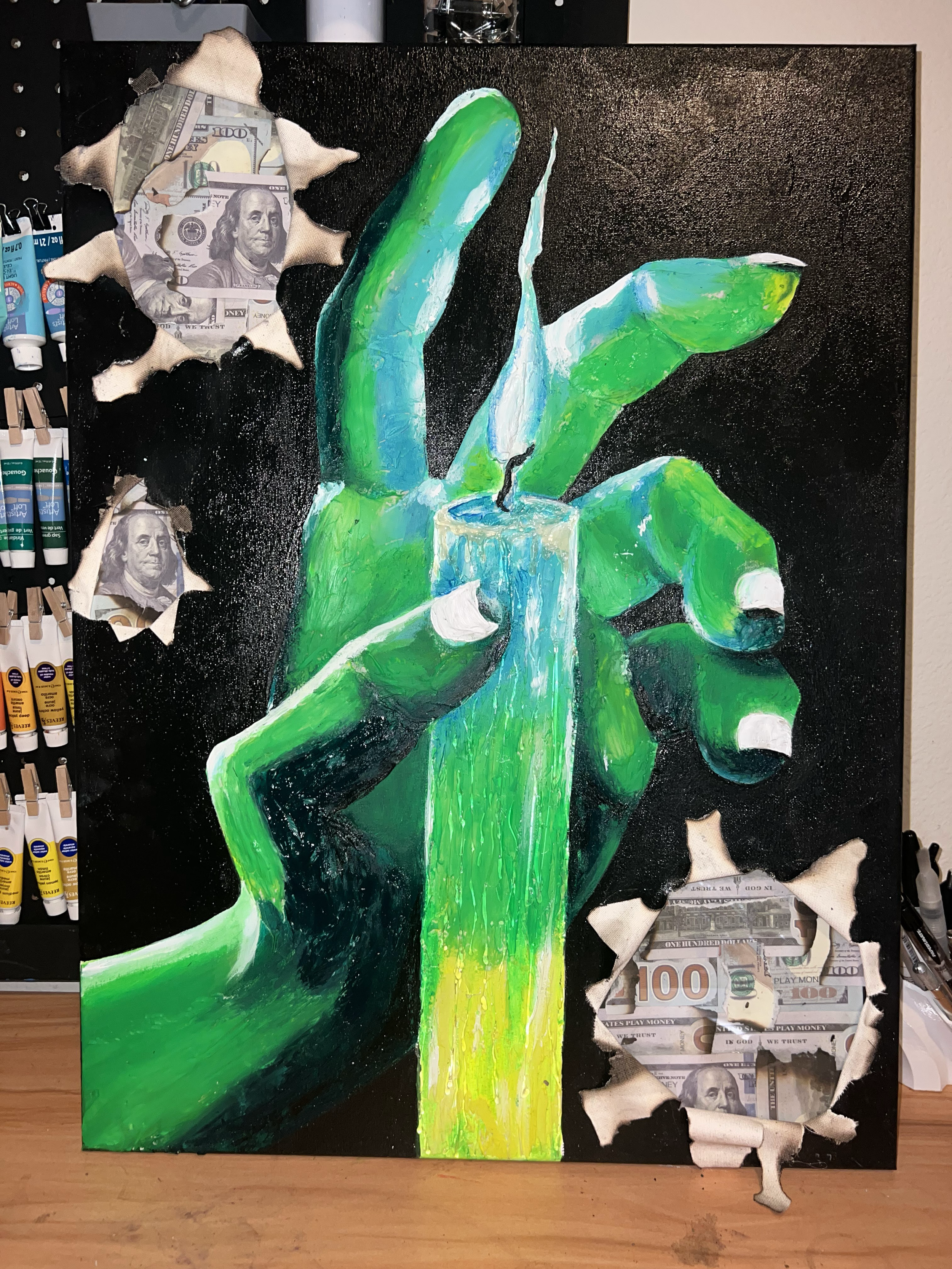 Painting of a green hand holding a lit candle, with torn holes revealing images of hundred-dollar bills inside.