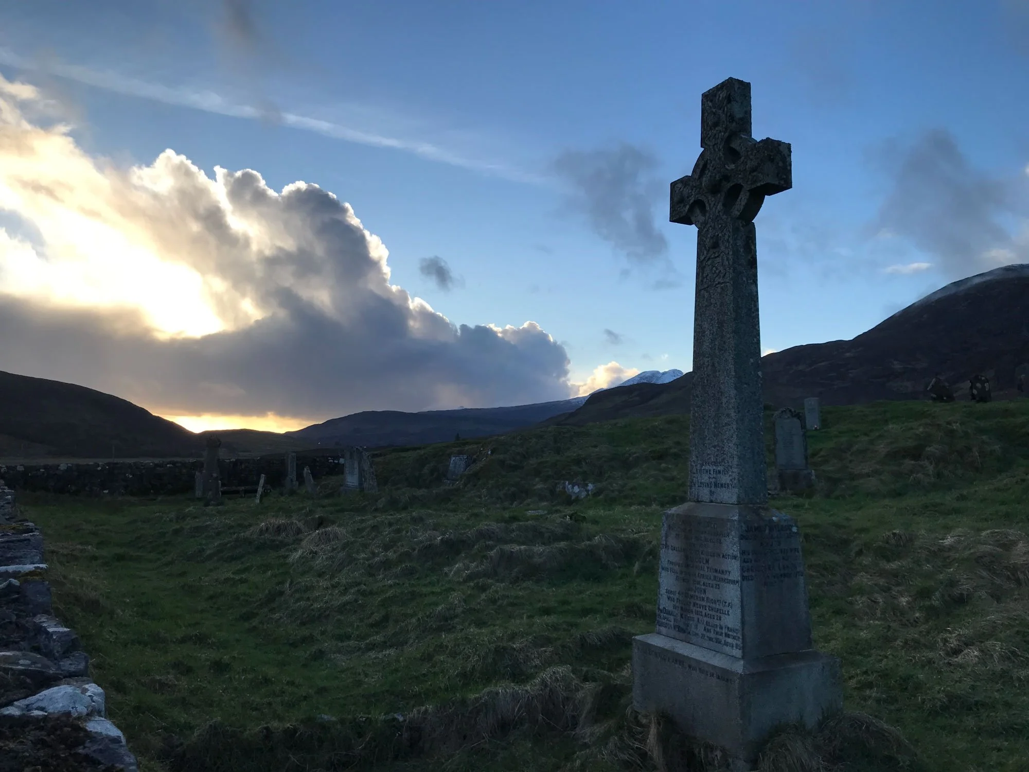 Stone cross in Isle of Skye landscape