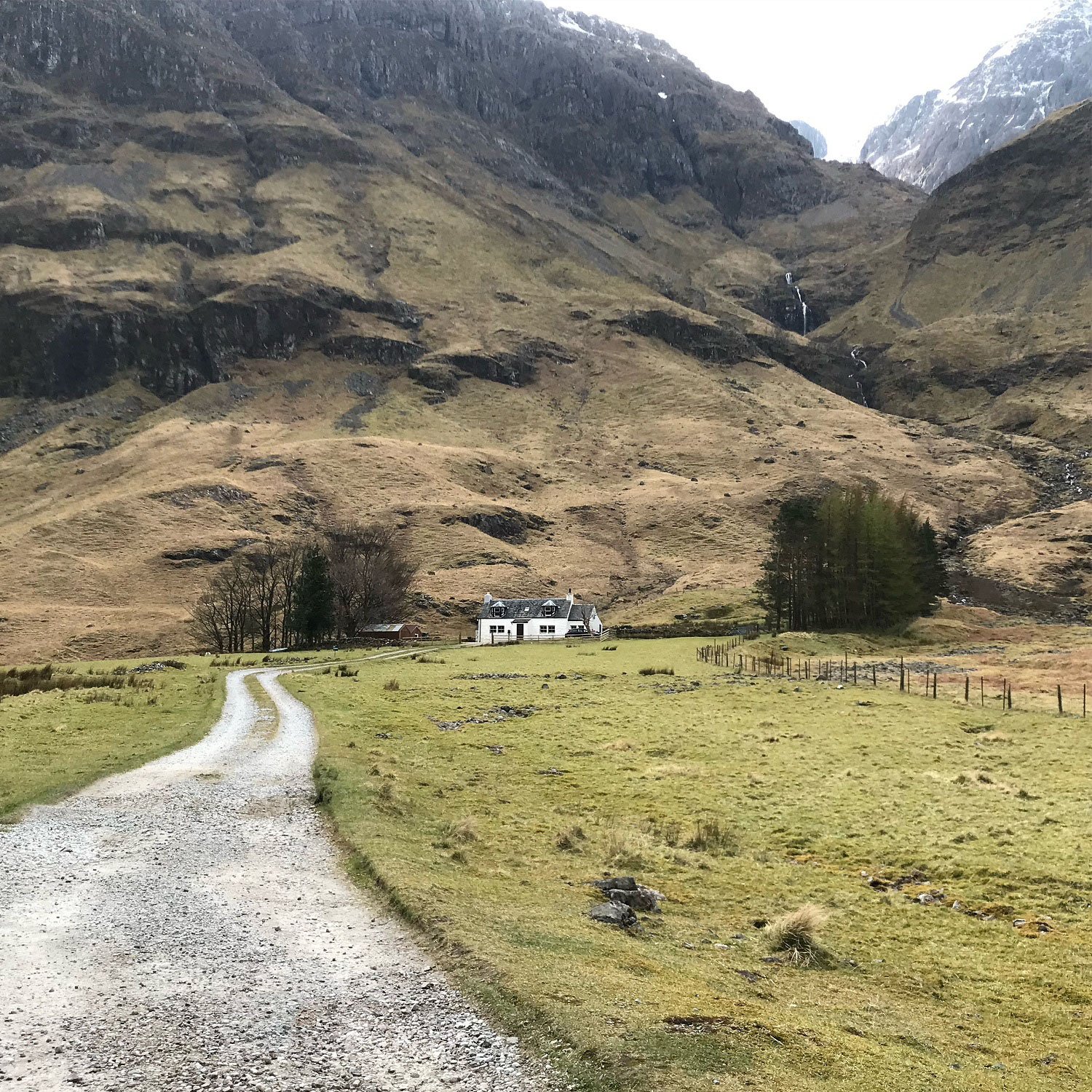 Gravel path leading to house in Glencoe valley Scotland