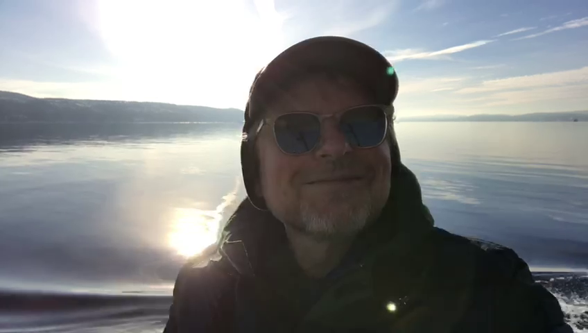 Sandy Kilpatrick by the sea in a cinematic coastal landscape