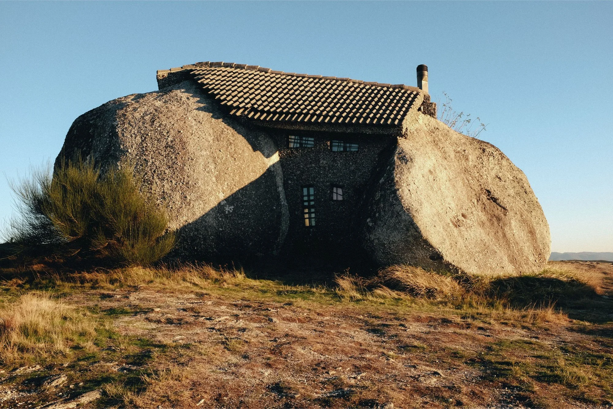 Stone house built into rock in Portugal