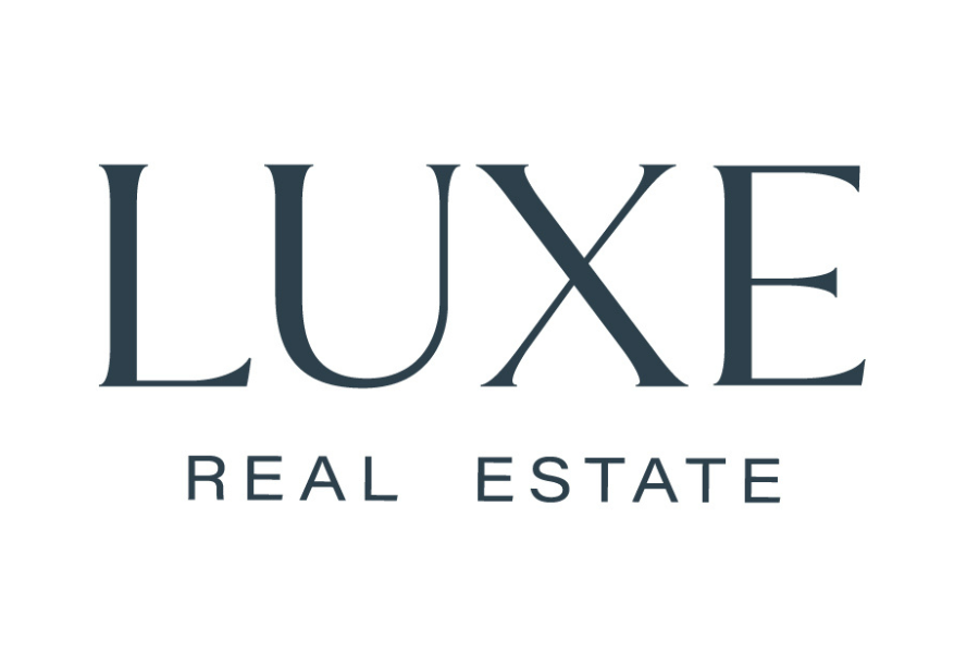Luxe Real Estate logo with the words 'LUXE' in large font and 'REAL ESTATE' below it in smaller font.