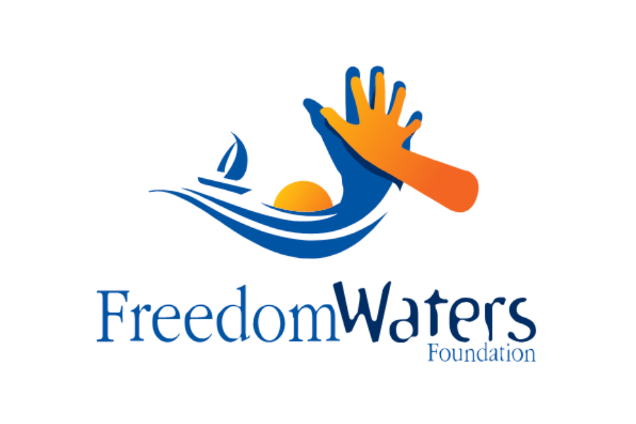 A logo for Freedom Waters Foundation featuring a stylized blue wave, a yellow sun, and an orange and blue hand reaching out.