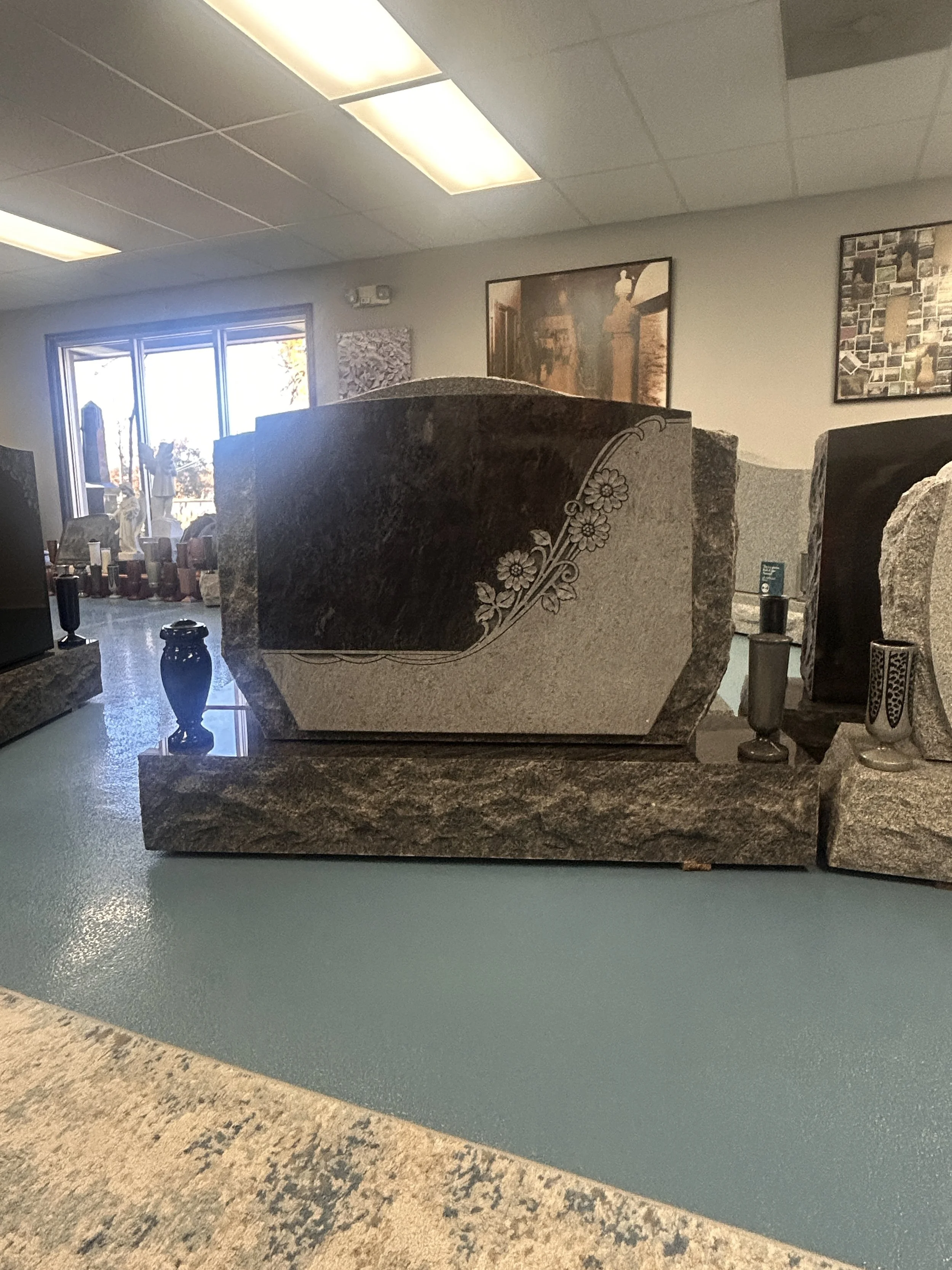 Interior of a store or showroom displaying large granite or marble slabs