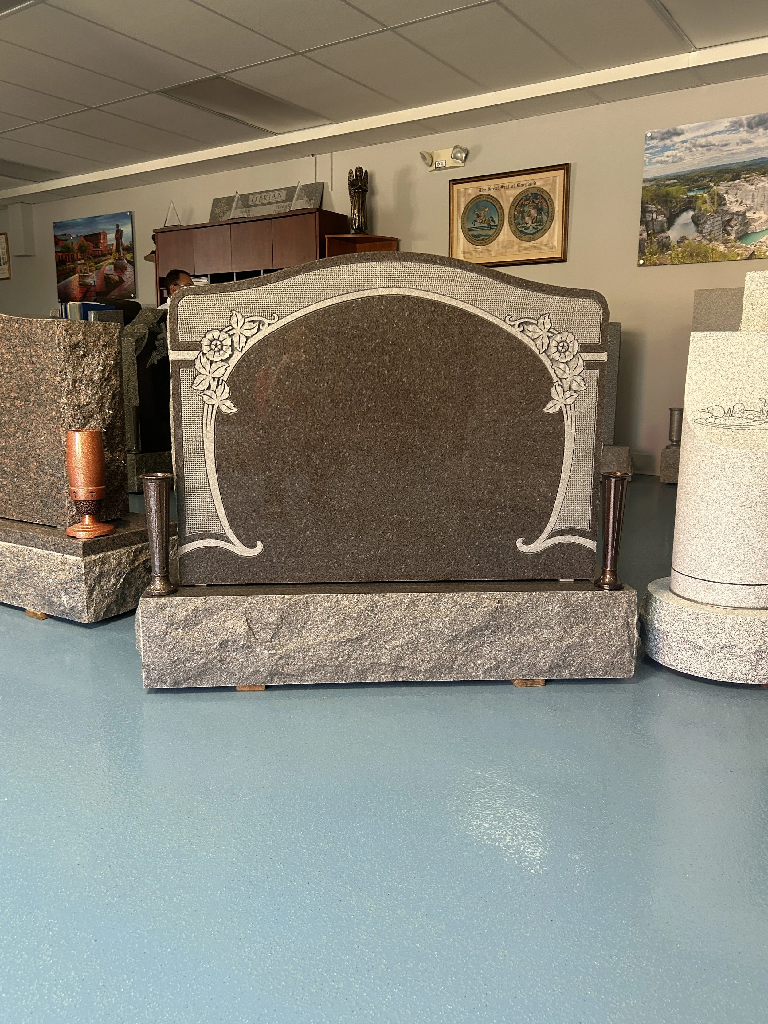 Various types of gravestones in a memorial display room