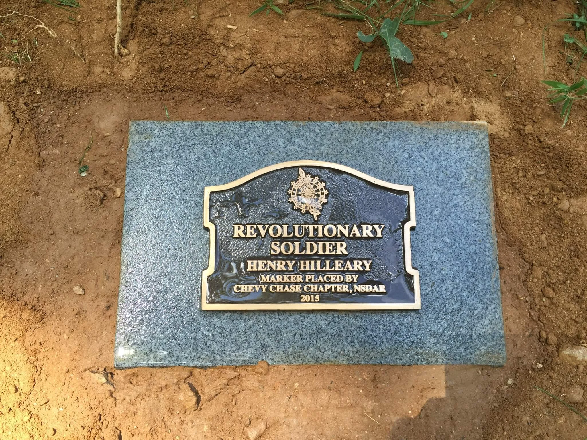 Gravestone with black plaque and gold border, reading 'Revolutionary Soldier Henry Kelley