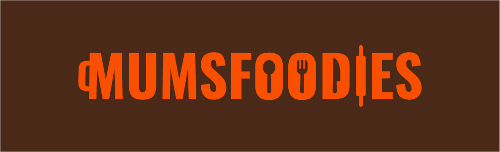 Logo for Mum's Foodies with stylized orange text and cutlery icons inside the letters on a brown background.