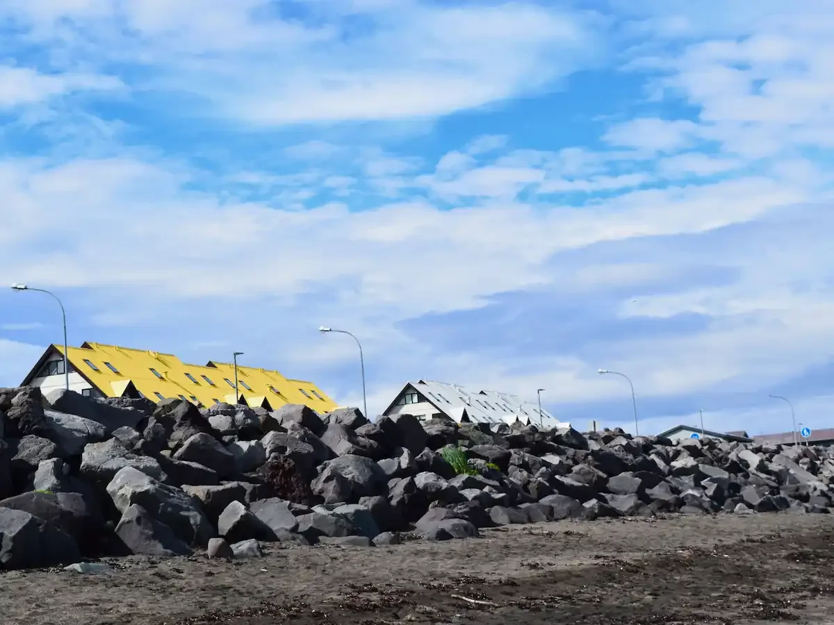 Copyright Knot Waste: Reykjavik, Iceland: A rock sea break protects the local colourful houses. 