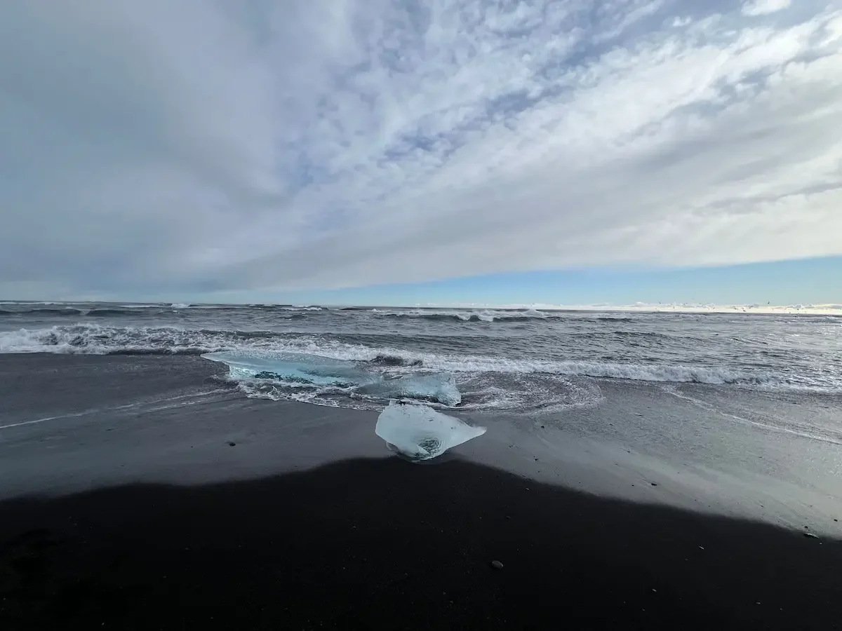 Copyright Knot Waste: Iceland Diamond Beach - You see the best icebergs at Diamond Beach from November to March, as cold winter weather and strong ocean tides push large, solid ice chunks onto the black sand.