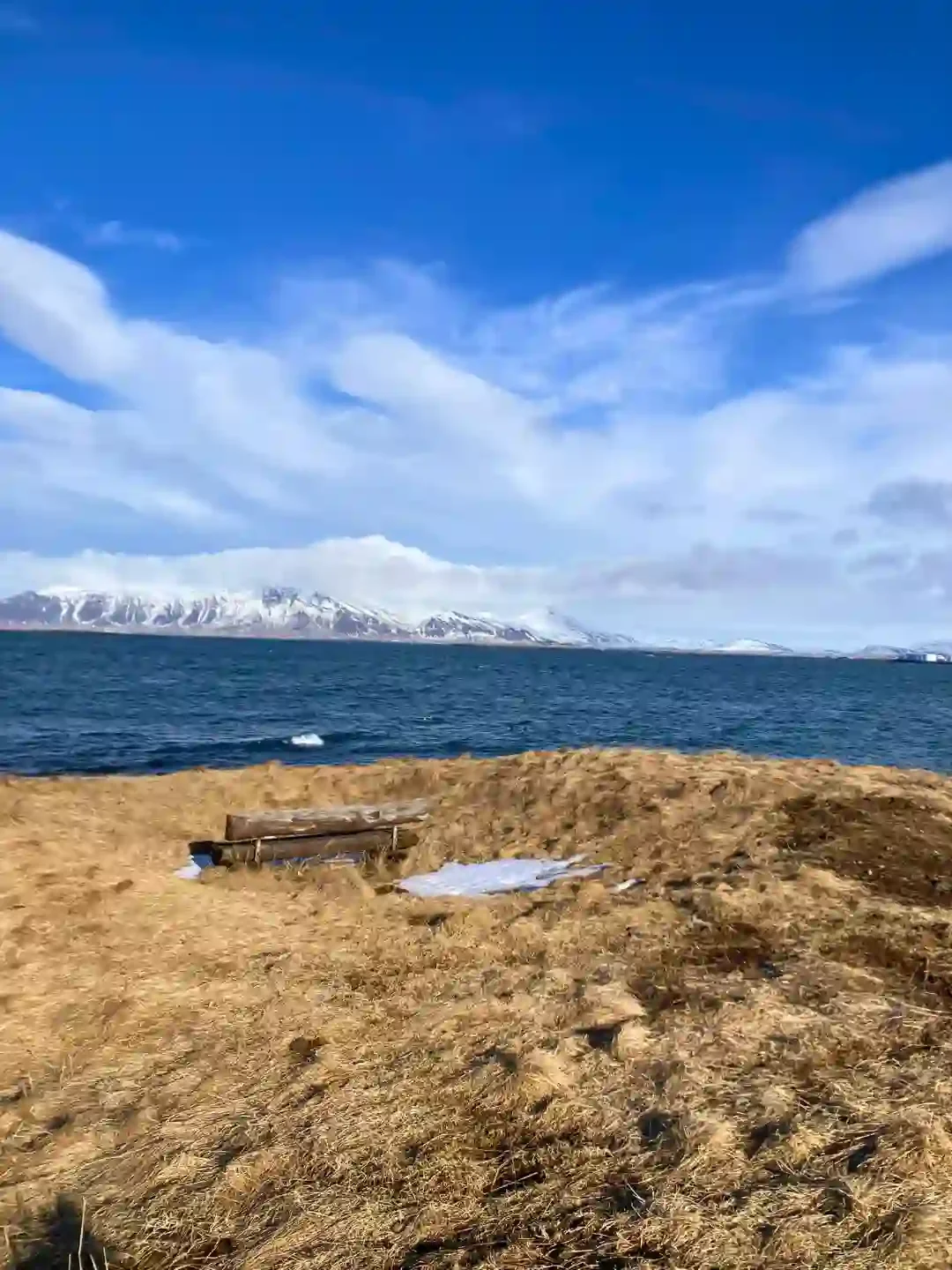 Copyright Knot Waste: Reykjavik, Iceland - A bench with a view of the mountains and ocean.