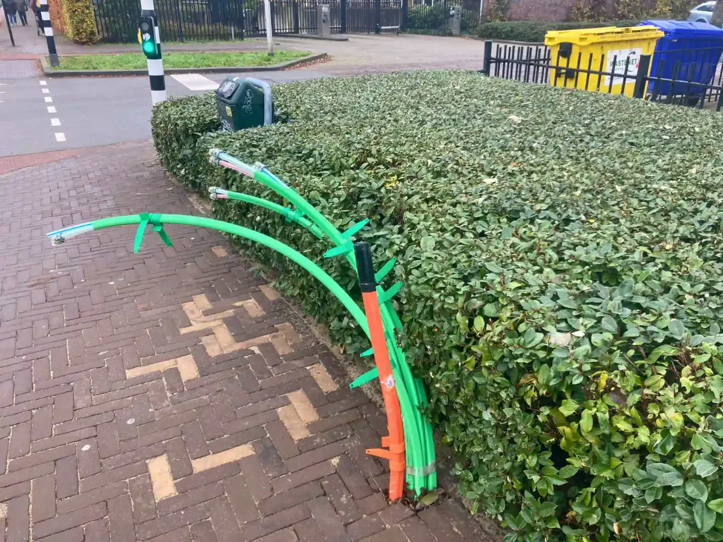 Urban Greening - tilburg - netherlands - colourful - power - pipes - by - hedge .webp