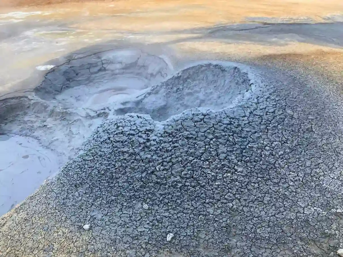 Copyright Knot Waste: Akureyi Trip, Iceland: A mud pot is a hot spring with a small amount of water where acidic gases turn surrounding rock into bubbling, boiling clay.