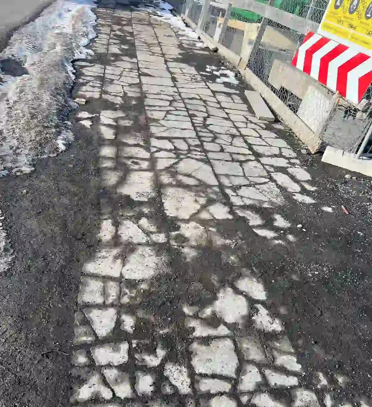Copyright Knot Waste: Reykjavik, Iceland: Ice thawing on an urban street next to construction work. Urban sidewalks in Reykjavík often use geothermal melting to stay clear. Rural areas however often face closures.