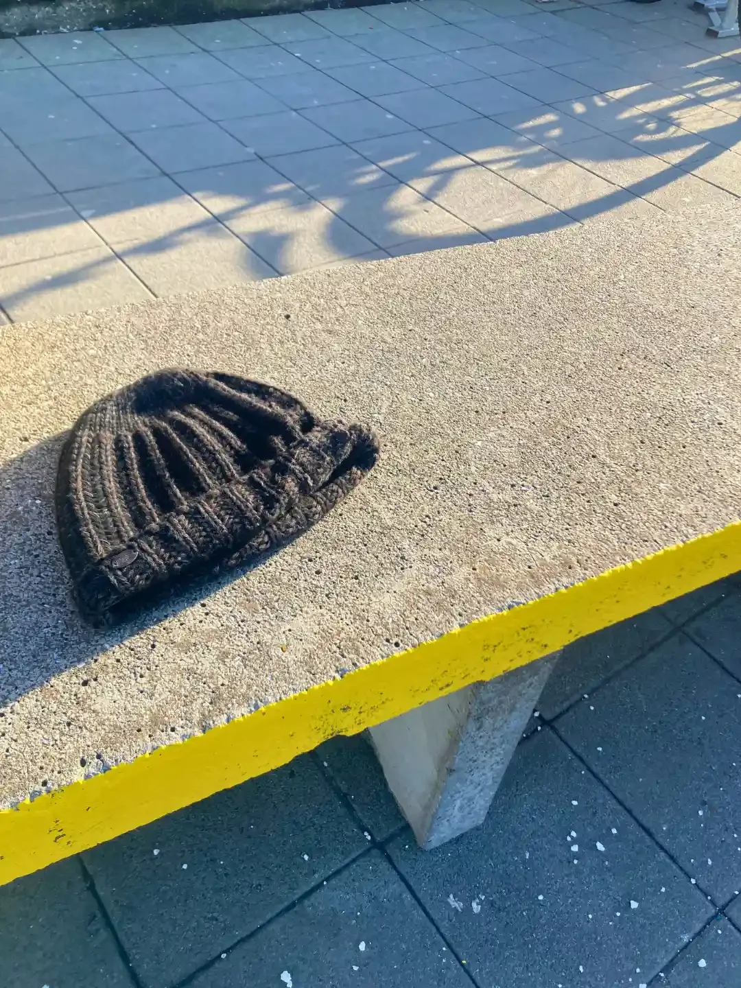 Urban Litter - reykjavik - iceland - hat - on - concrete - bench.webp