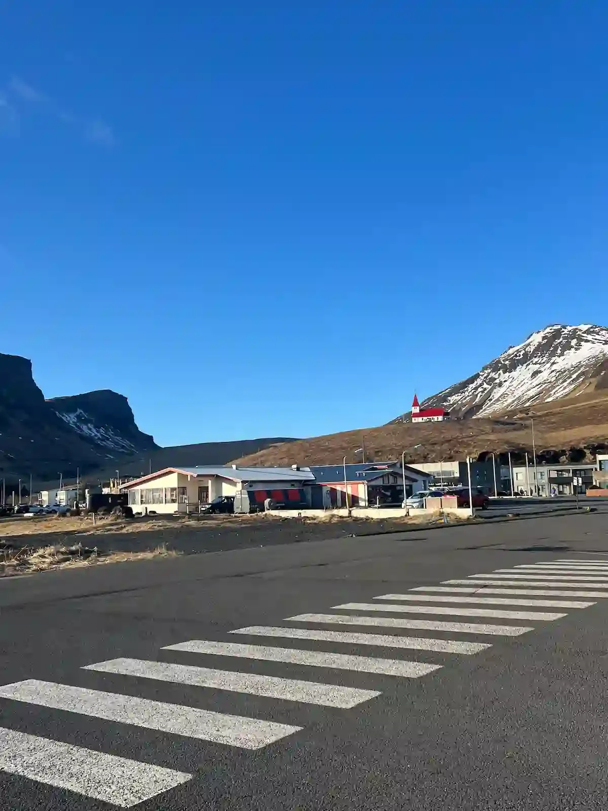 Copyright Knot Waste: Iceland, Village of Vik - The village sits below the Mýrdalsjökull ice cap, which conceals the powerful Katla volcano. An eruption could melt glacial ice and trigger a massive flash flood. The church on the hill serves as the de