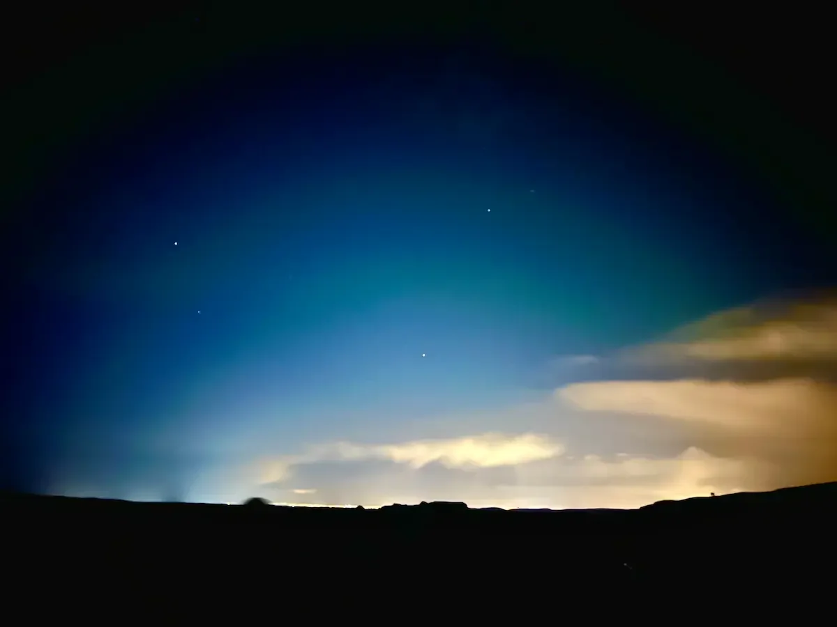 Copyright Knot Waste: Iceland, Northern Lights - The green lights trying its hardest to appear through the light pollution. 