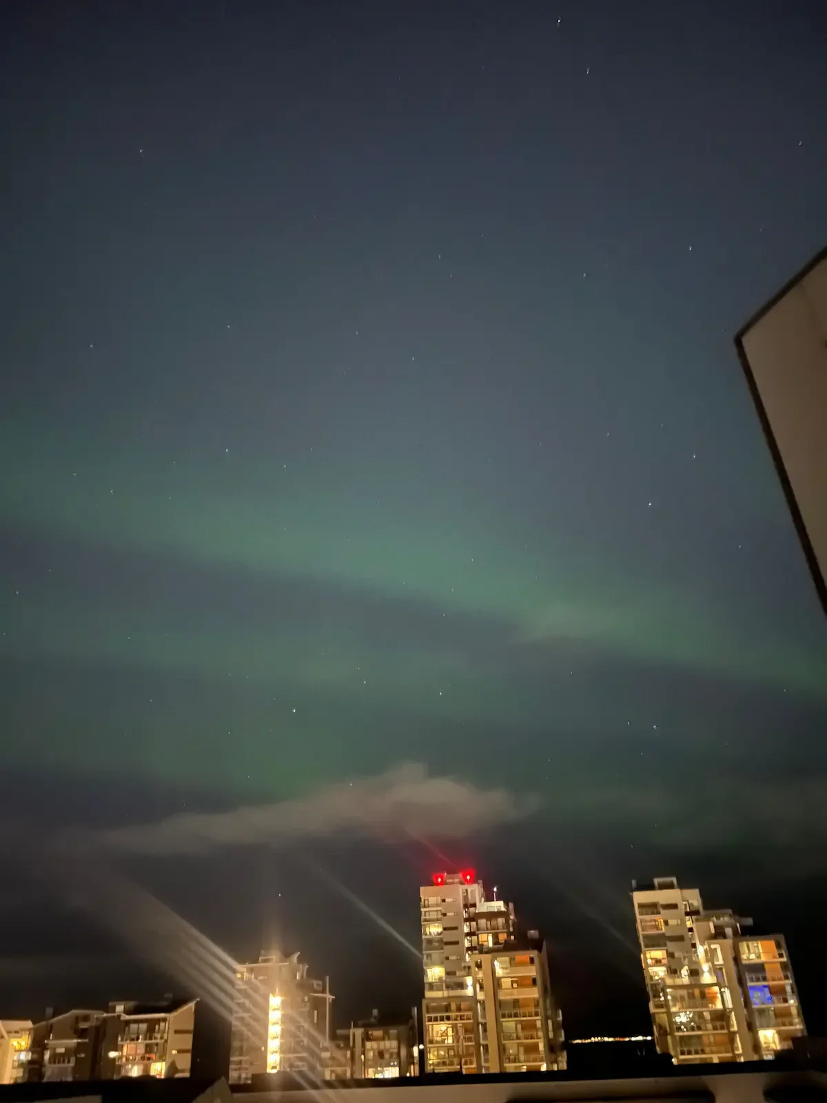 Copyright Knot Waste: Iceland, Northern Lights - The light pollution from the city dims the Aurora Borealis but it is still possible to view them in the city skies on an active night.