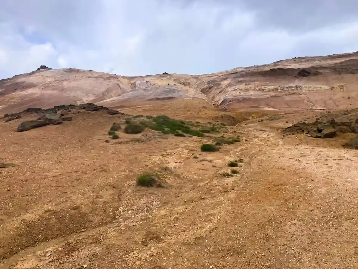 Copyright Knot Waste: Akureyi Trip, Iceland: The landscape directly by a mud pot is free from vegetation because of the extreme heat, high acidity, and toxic volcanic gases.