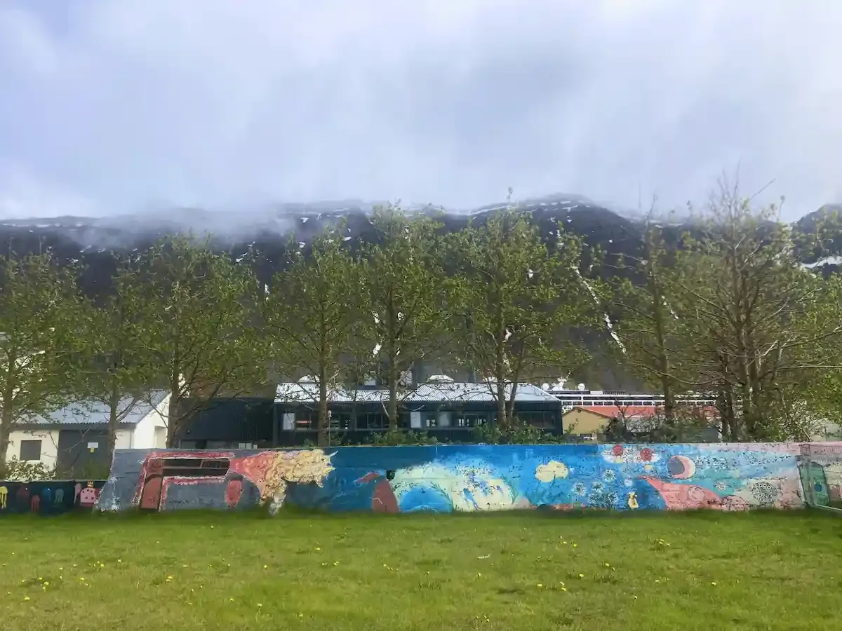 Copyright Knot Waste: Ísafjörður, Iceland - A dog park decorated with a nature inspired mural along its walls. 