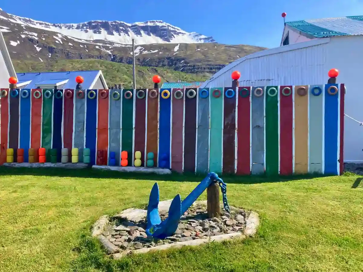 Copyright Knot Waste: Seyðisfjörður, Iceland - Colorful street art is often nestled against a dramatic fjord backdrop.