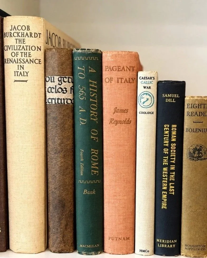 Vintage hardcover books styled on a shelf