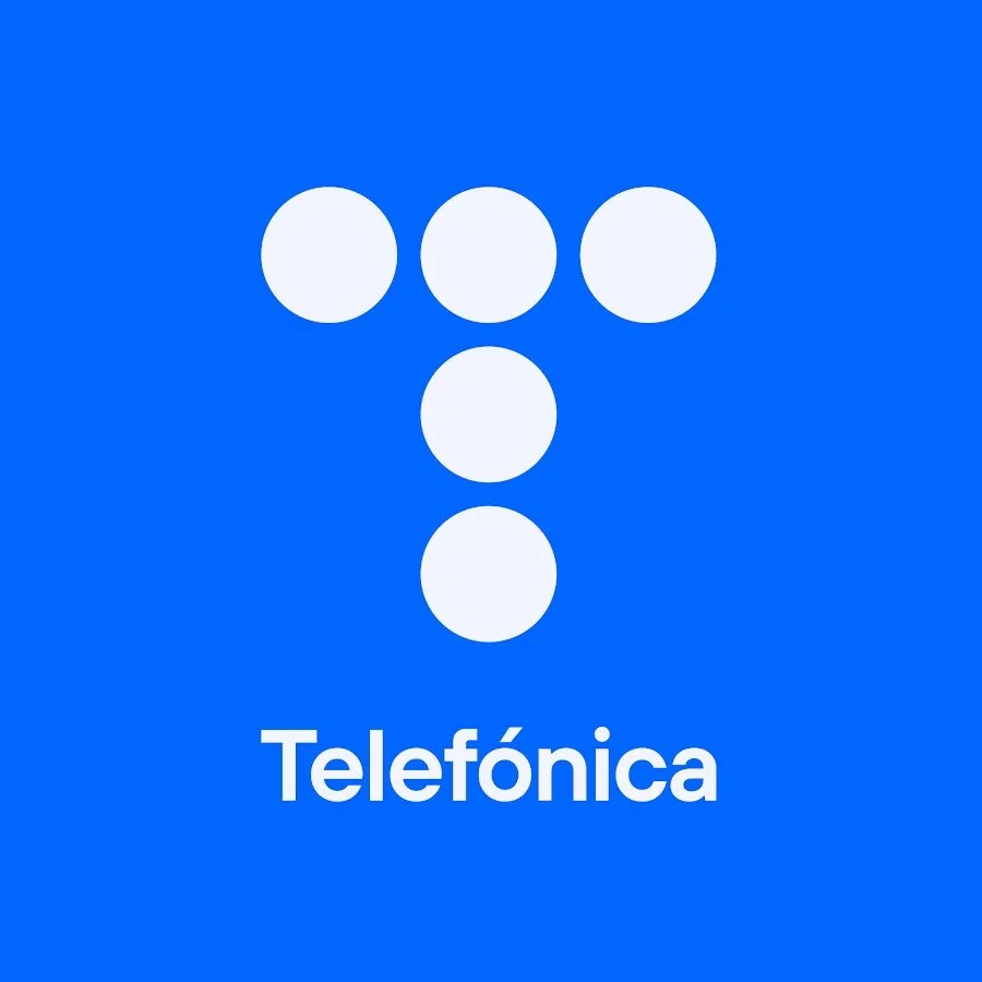Blue background with a white lowercase 't' made of six white circles, and the word 'Telefónica' written below.