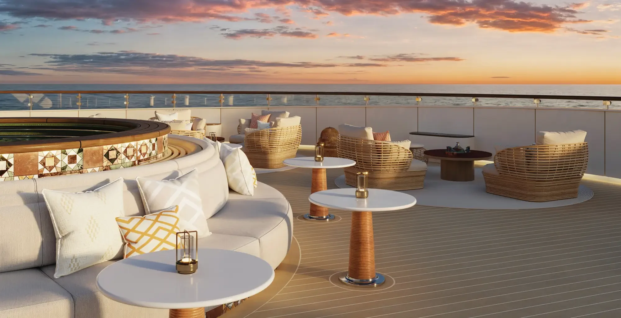 Relaxing area on the outdoor deck lounge of a Four Seasons yacht at sunset, surrounded by ocean views and refined hospitality.
