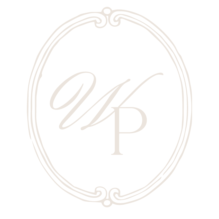 A black and white logo with a decorative oval frame surrounding the initials 'W' and 'P'.