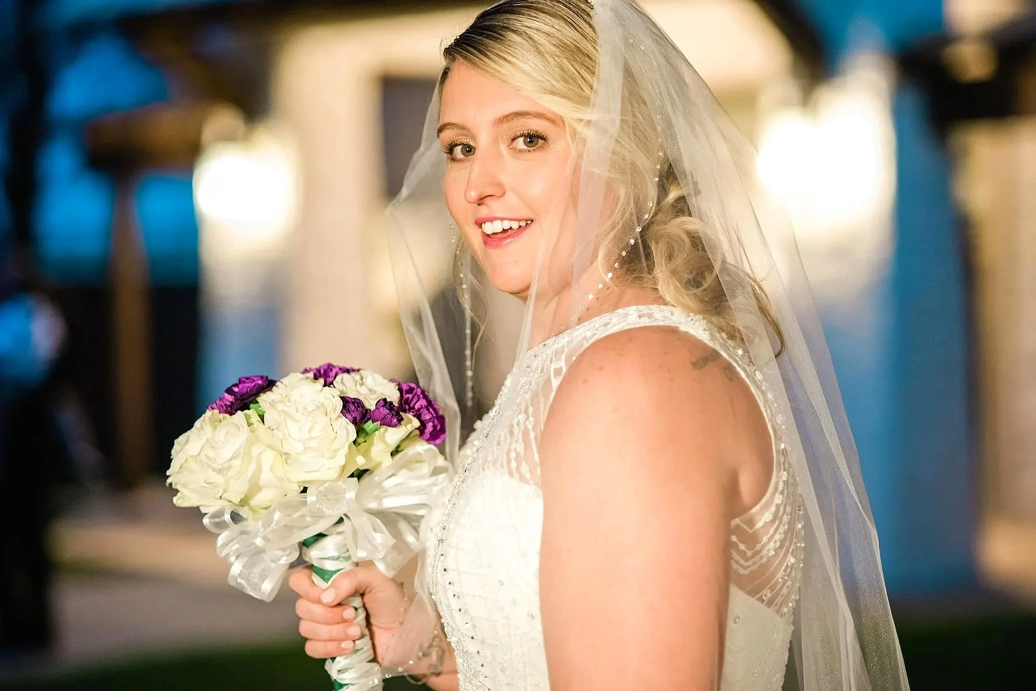 Radiant bridal makeup by Elisa Flowers photographed in warm evening wedding light