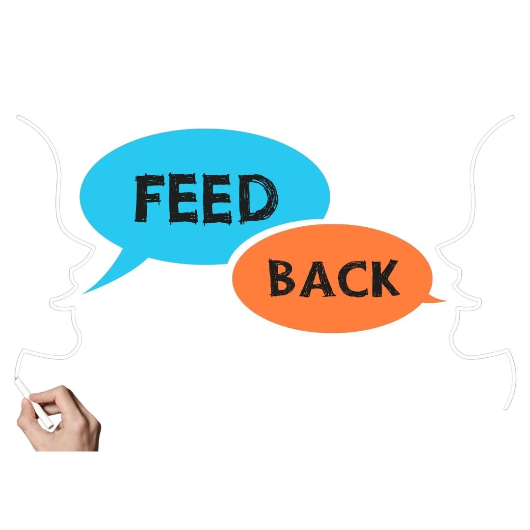 Two speech bubbles, one blue with the word 'FEED' and one orange with the word 'BACK', connected by arrows, with a hand drawing on the left side.