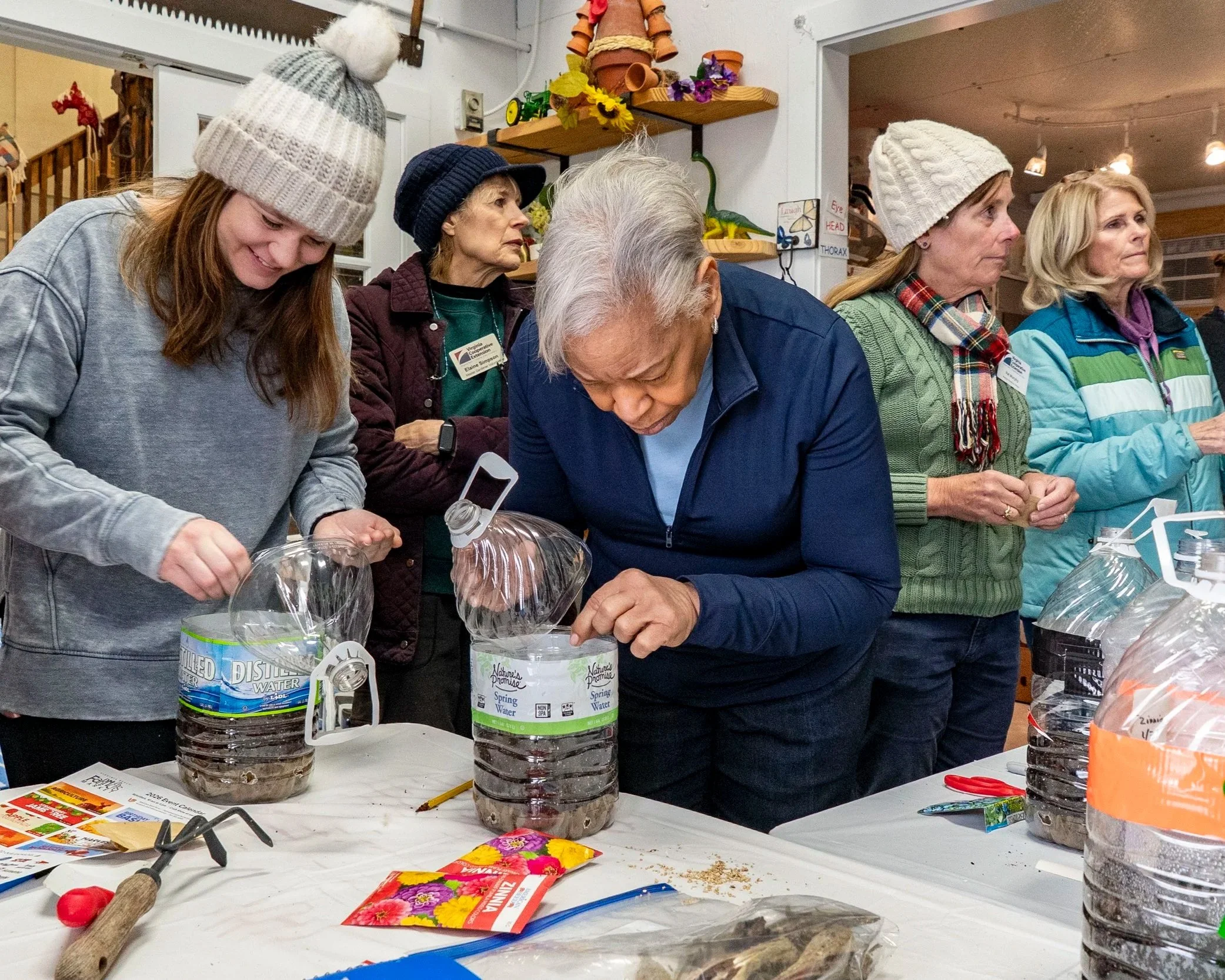 Master Gardener Interns learning to winter sow. 