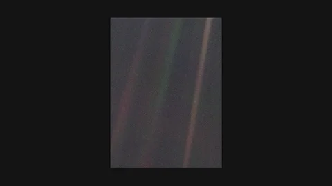 Voyager 1, 1990: Earth as a pale blue speck in deep space – first photograph of Earth from 6 billion km