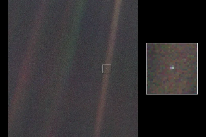 Voyager 1, 1990: Annotated view marking Earth's position as a single bright pixel in the full frame