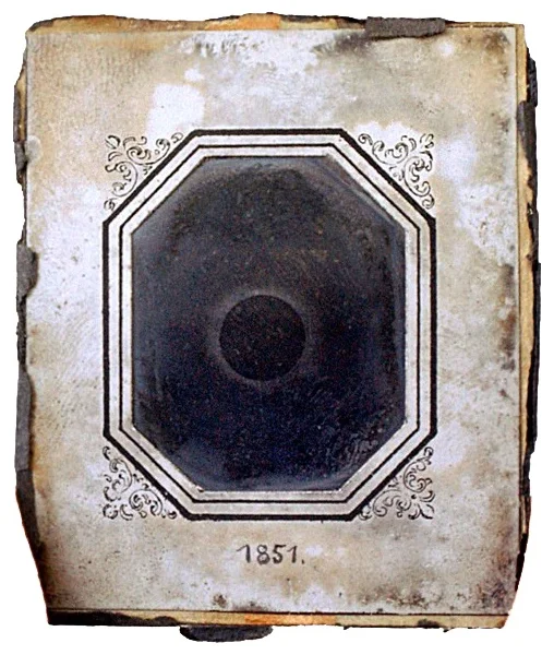 Berkowski 1851: original daguerreotype plate in ornate octagonal mount showing total solar eclipse – physical artefact with aged silver surface