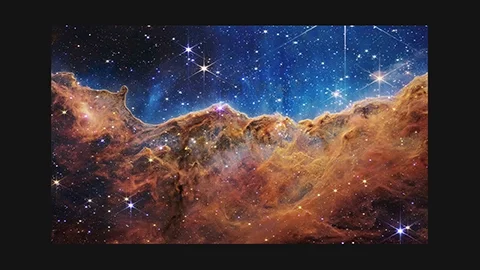 Webb 2022: Infrared view of Carina Nebula's Cosmic Cliffs – star-forming gas and dust towers spanning 16 light-years